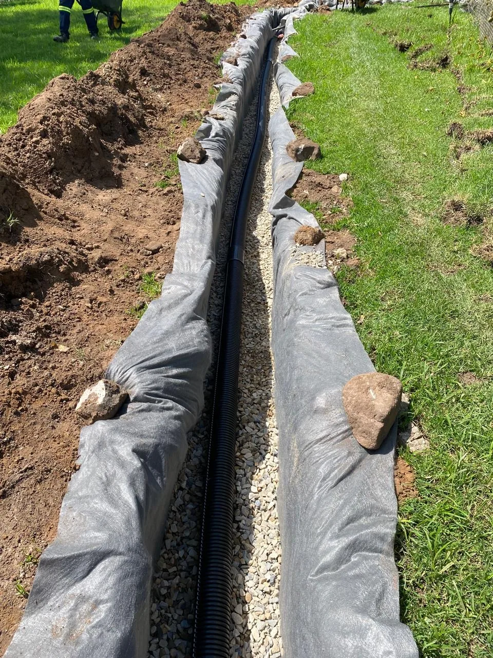 Waterlogged garden bed before French drain install